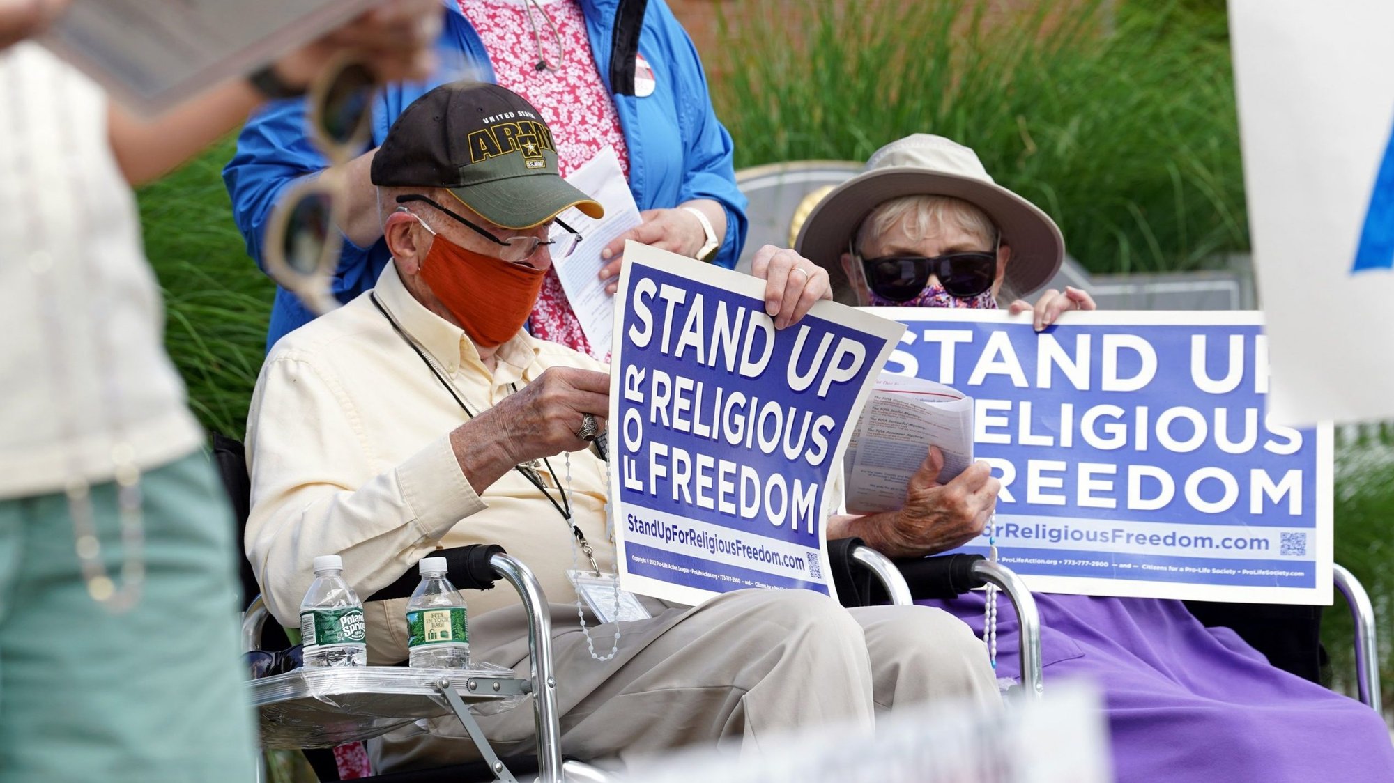 Eric and Anne Waxman recite the rosary while participating in a roadside prayer rally marking Religious Freedom Week at St. James Church in Setauket, N.Y., June 24, 2020. (CNS photo/Gregory A. Shemitz)