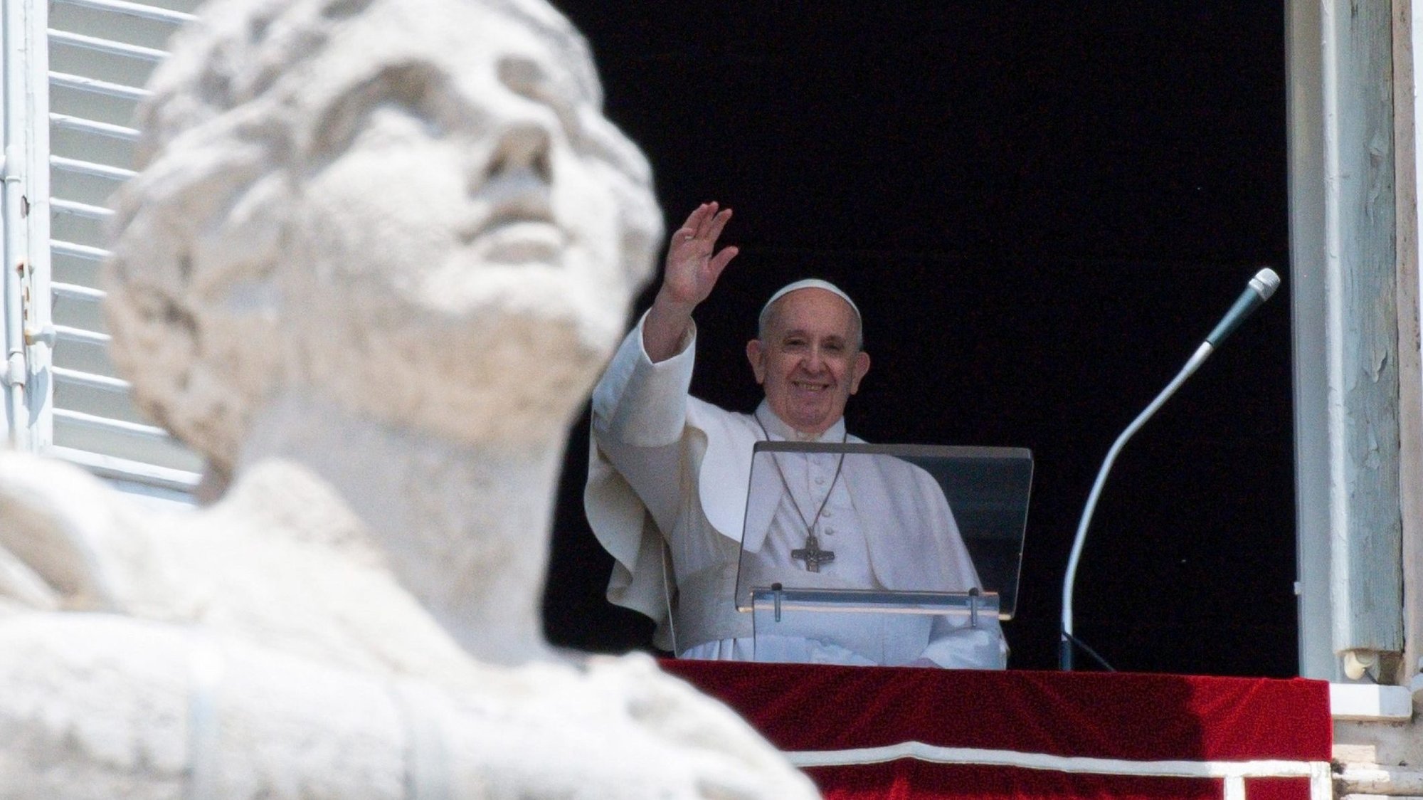 Pope Francis greets the crowd as he leads the Angelus from the window of his studio overlooking St. Peter's Square at the Vatican June 13, 2021. (CNS photo/Vatican Media)