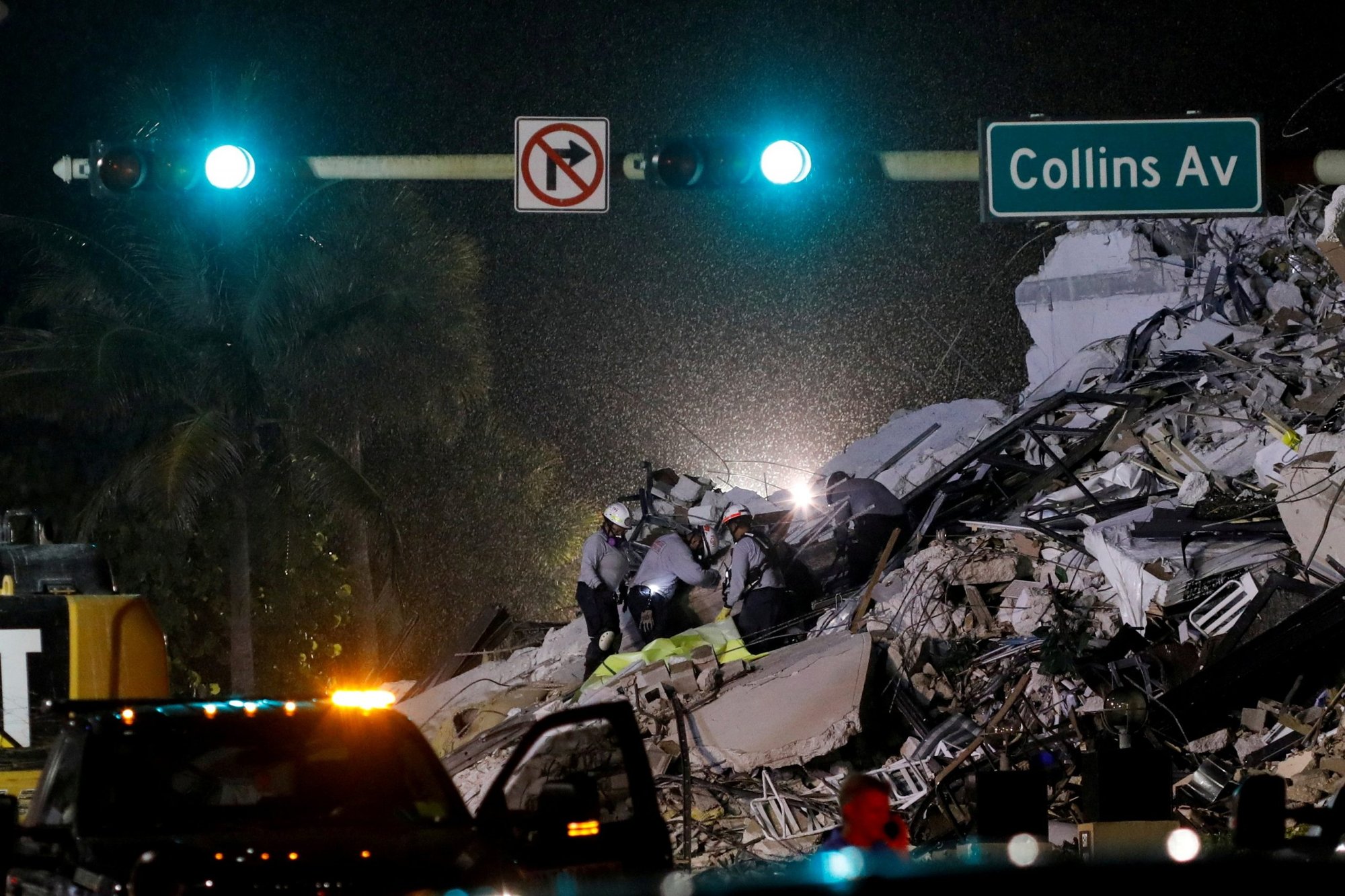 Emergency crews in Surfside, Florida, just north of Miami Beach, respond in the rain to the partial collapse of a residential building June 24, 2021. (CNS photo/Marco Bello, Reuters)