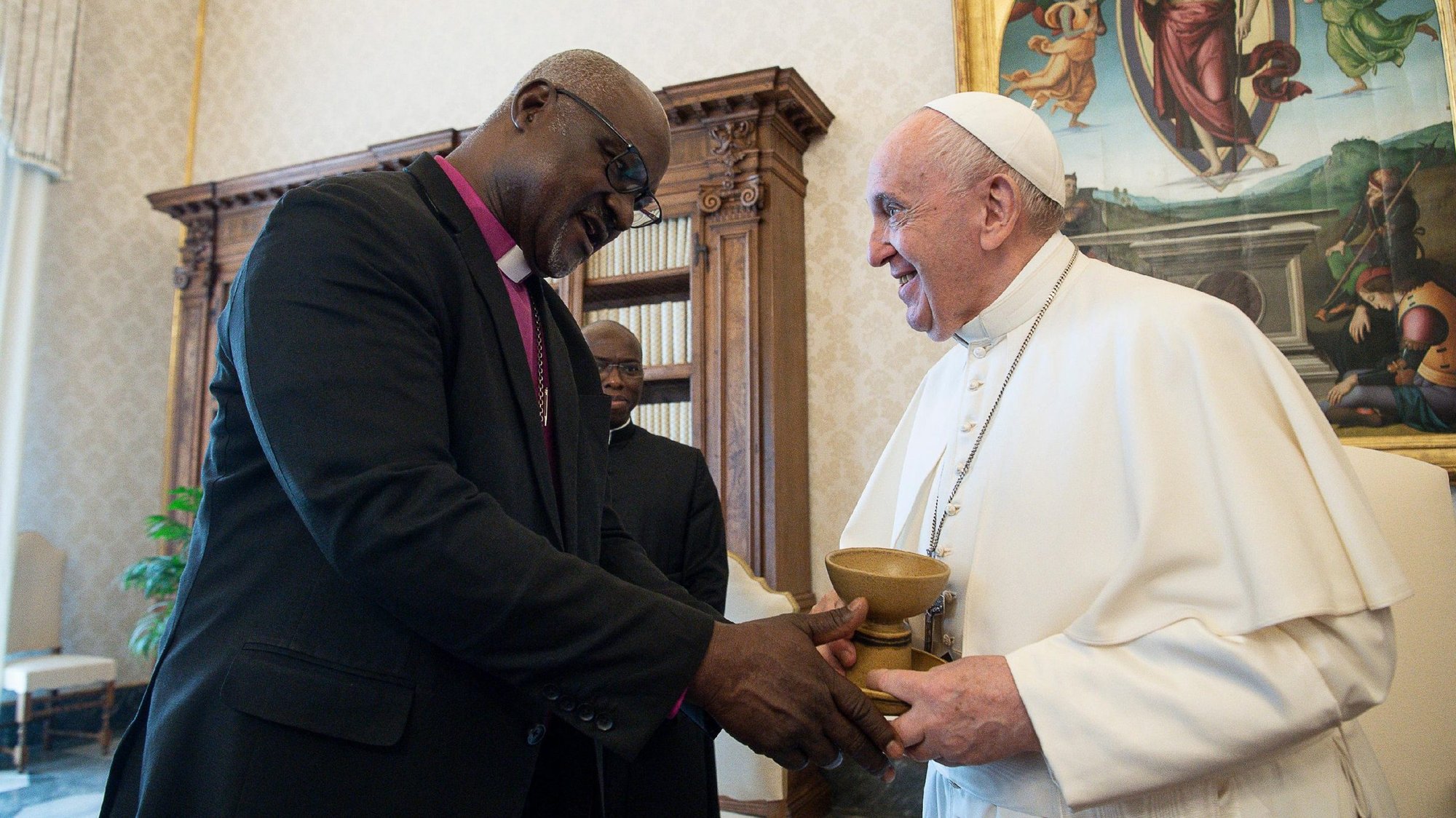 Nigerian Lutheran Archbishop Panti Filibus Musa, president of the Lutheran World Federation, gives Pope Francis a chalice and paten during a meeting at the Vatican June 25, 2021. (CNS photo/Vatican Media)