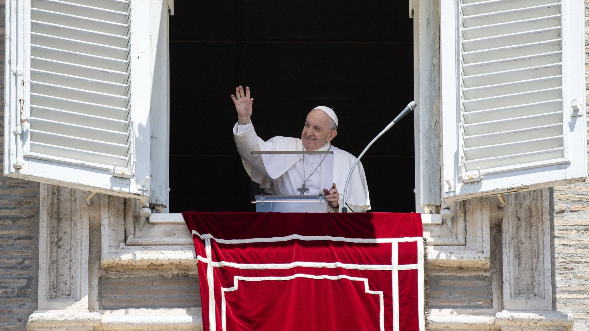 Pope Francis greets the crowd as he leads the Angelus from the window of his studio overlooking St. Peter's Square at the Vatican June 28, 2021. (CNS photo/Vatican Media)