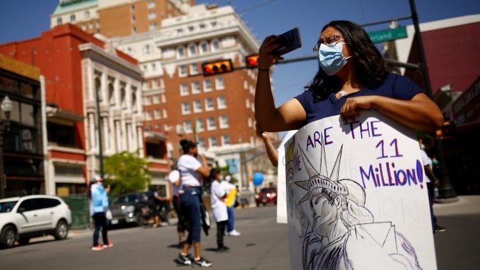 A woman attends a march held by members of the Border Network for Human Rights and the Reform Immigration Alliance for Texas in El Paso, Texas, April 10, 2021, to launch the new "We Are The 11 Million" campaign demanding immigration reform and a pathway to citizenship for all immigrants living in the U.S. without documents. (Jose Luis Gonzalez/CNS, Reuters via Crux)