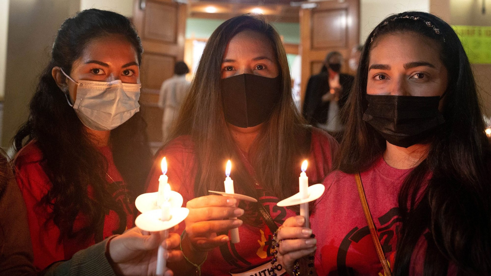 The youth ministry group at St. Joseph Parish in Miami Beach, Fla., host a eucharistic prayer and candlelight vigil for those who have died and who are still missing June 26, 2021, of the nearby partially collapsed condo in Surfside, Fla. The evening included a walkthrough of the neighborhood close to the condo. (CNS photo/Tom Tracy, Florida Catholic)