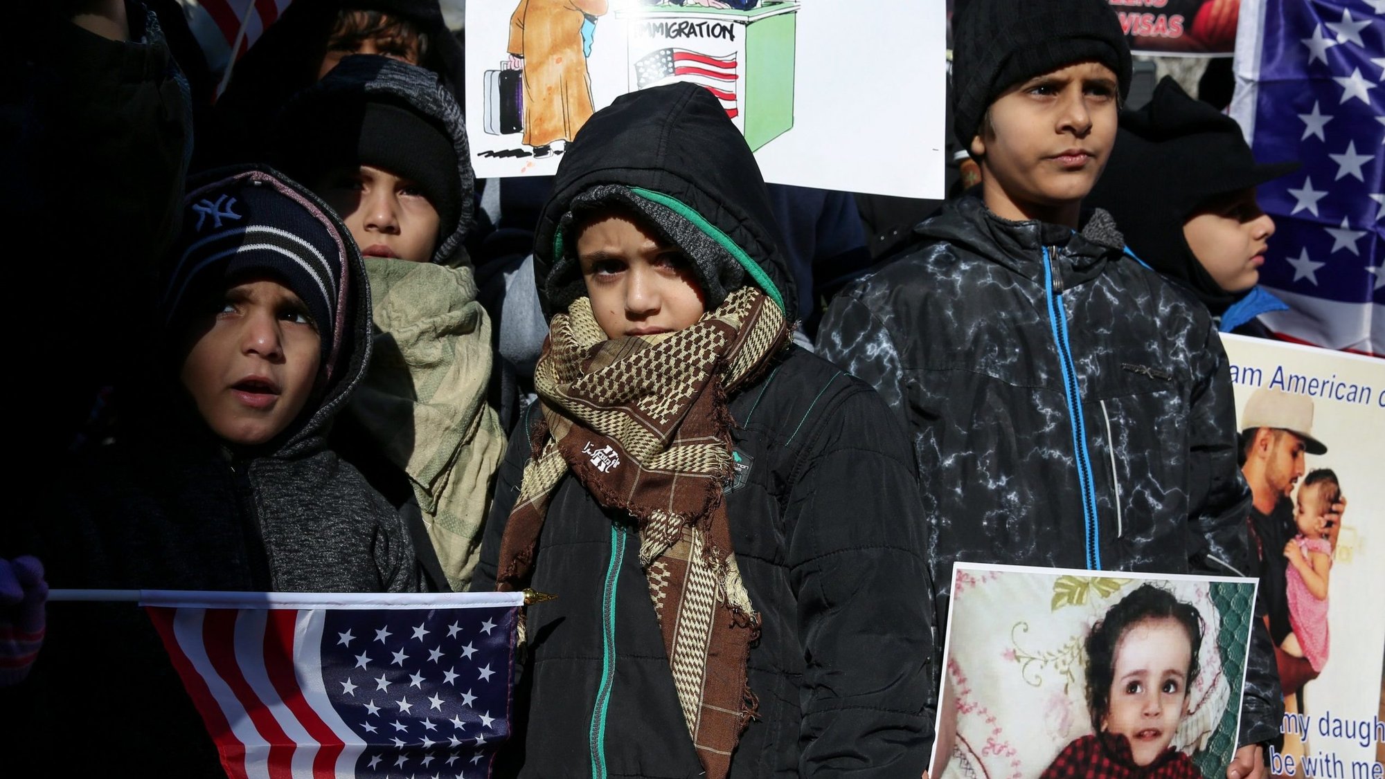 Yemeni Americans in New York City demonstrate Dec. 27, 2017, against then-President Donald Trump's travel ban and recent denials of visa applications. On July 6, 2021, the Biden administration announced an 18-month extension of Temporary Protected Status for the approximately 2,200 Yemeni nationals in the U.S. (CNS photo/Amr Alfiky, Reuters)