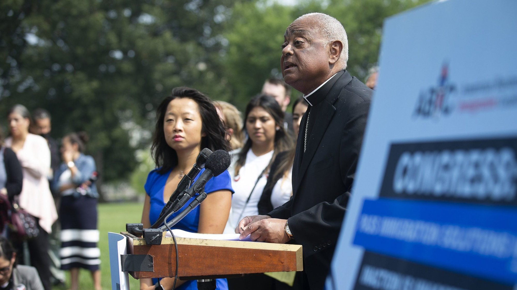Washington Cardinal Wilton D. Gregory in remarks outside the U.S. Capitol in Washington July 21, 2021, urges Congress to support immigration solutions that protect families. Also pictured is Rebecca Shi, executive director of the American Business Immigration Coalition. (CNS photo/Tyler Orsburn)