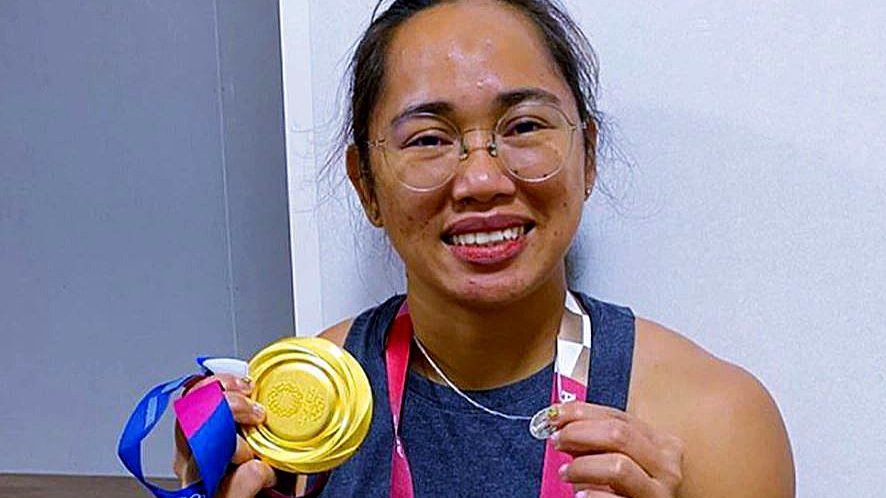 Hidilyn Diaz of the Philippines poses with her gold medal and Miraculous Medal after winning the gold in women's weightlifting at the 2020 Tokyo Olympics July 26, 2021. Diaz became the Philippines' first Olympic gold medal winner and set an Olympic record. (CNS photo/Hidilyn Diaz, Instagram, via CBCP News)