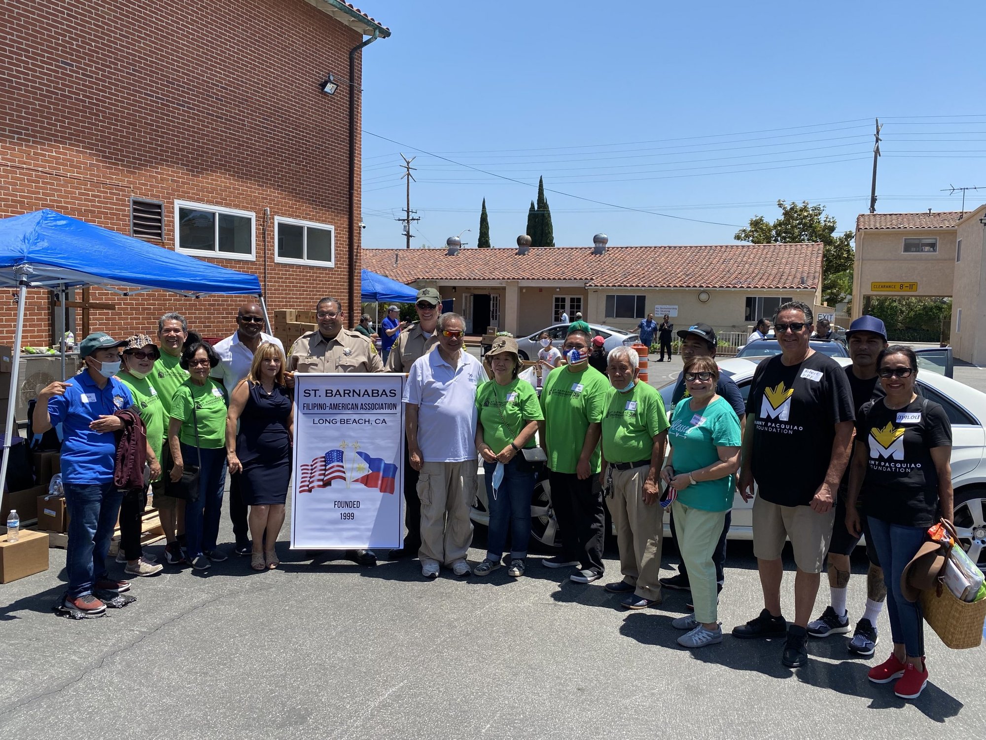Volunteers came from local charities to help at the St. Barnabas Church food drive June 26. (Long Beach Bacolod Association)