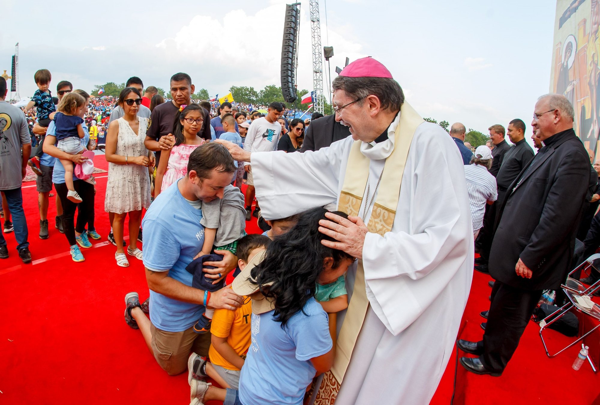 Archbishop Christophe Pierre, apostolic nuncio to the United States, blesses a young family at a vocational gathering for young people of the Neocatechumenal Way in Gettysburg, Pa., July 25, 2021. Some 250 young men and 400 young women who said they were discerning a vocation received a blessing from nuncio. At least 300 families who said they want to be missionaries also received the archbishop's blessing. (Courtesy photo)