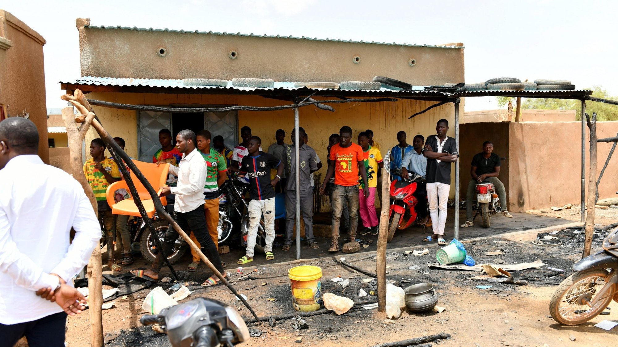 Residents gather June 7, 2021, at the site of an attack in the village of Solhan, Burkina Faso. Bishop Laurent Dabire of Dori condemned the June 5 attack by Islamists that left at least 160 people dead and urged residents to "keep faith and stay united." (CNS photo/Burkina Faso Prime Minister's Press Service handout via Reuters)