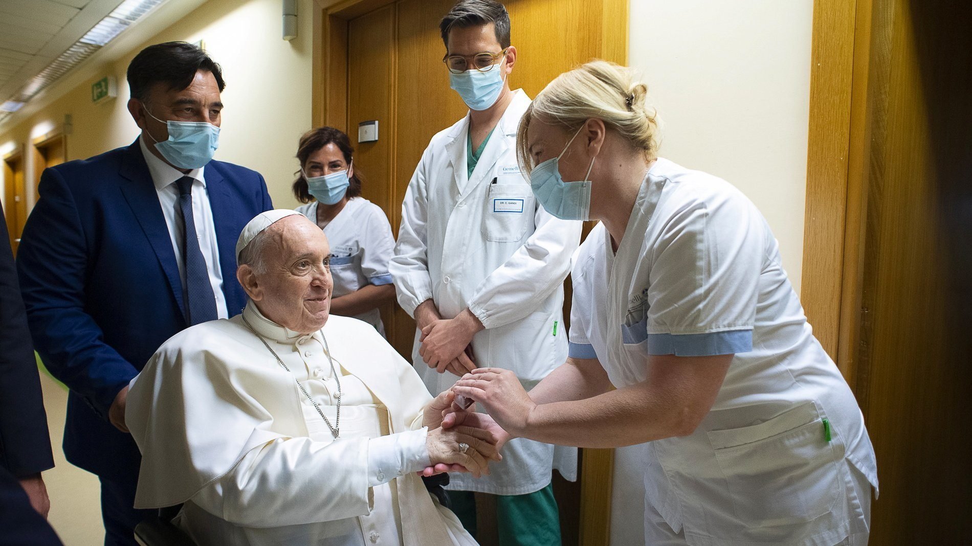 Pope Francis gives a rosary to a member of the medical staff at Gemelli hospital in Rome July 11, 2021, as he recovers following scheduled colon surgery. The pope expressed his gratitude for "making me feel at home" while he recovered from surgery, in a July 15 letter to the chairman of the board of directors of the hospital. He was released July 14. (CNS photo/Vatican Media via Reuters)