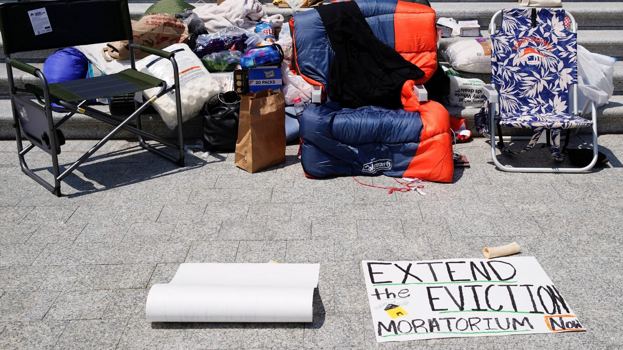 A sleeping bag is seen on the chair of U.S. Rep. Cori Bush, D-Mo., who spent the night on the steps of the U.S. Capitol in Washington July 31, 2021, to highlight the midnight expiration of the pandemic-related federal moratorium on residential evictions. President Joe Biden issued a new moratorium on evictions by executive order Aug. 3. (CNS photo/Elizabeth Frantz, Reuters)