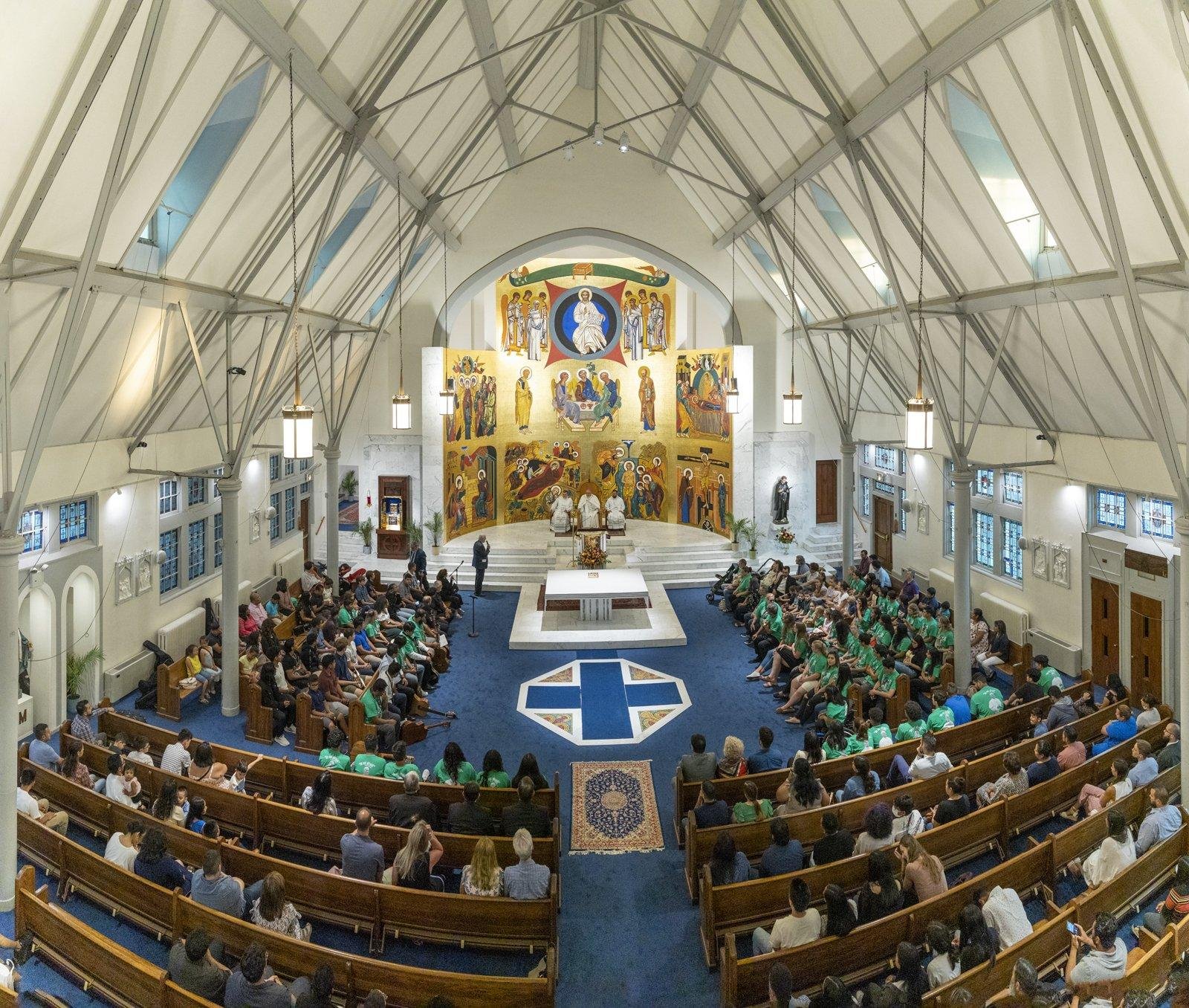Bishop Nicholas DiMarzio of Brooklyn, N.Y., leads a vespers service at St. Gabriel of the Sorrowful Mother Catholic Church in the Queens borough of New York City July 28, 2021. The service was to bless the final component of the church's renovation, the 35-by-45-foot painted altarpiece by Spanish artist David Lopez Ribes. (CNS photo/Joe Polillio)