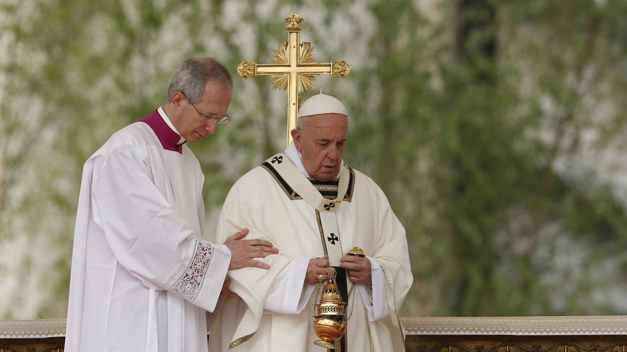 Msgr. Guido Marini, papal master of ceremonies, assists Pope Francis during Easter Mass in St. Peter's Square at the Vatican April 21, 2019. The pope has named Msgr. Marini as bishop of the northern Italian Diocese of Tortona. Bishop-designate Marini has served as papal master of ceremonies since 2007. (CNS photo/Paul Haring)