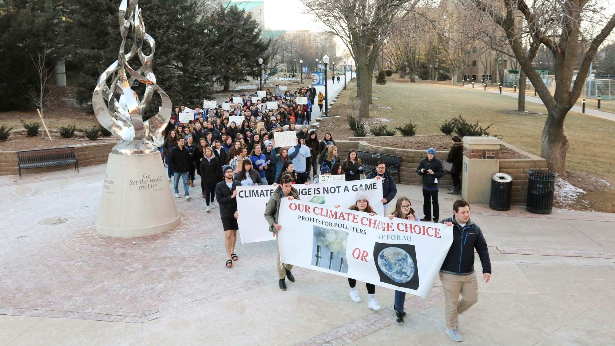 People rally at Creighton University in Omaha, Neb., Feb. 20, 2020, calling for the Jesuit-run school to fully divest from fossil fuels. (CNS photo/courtesy Emily Burke)