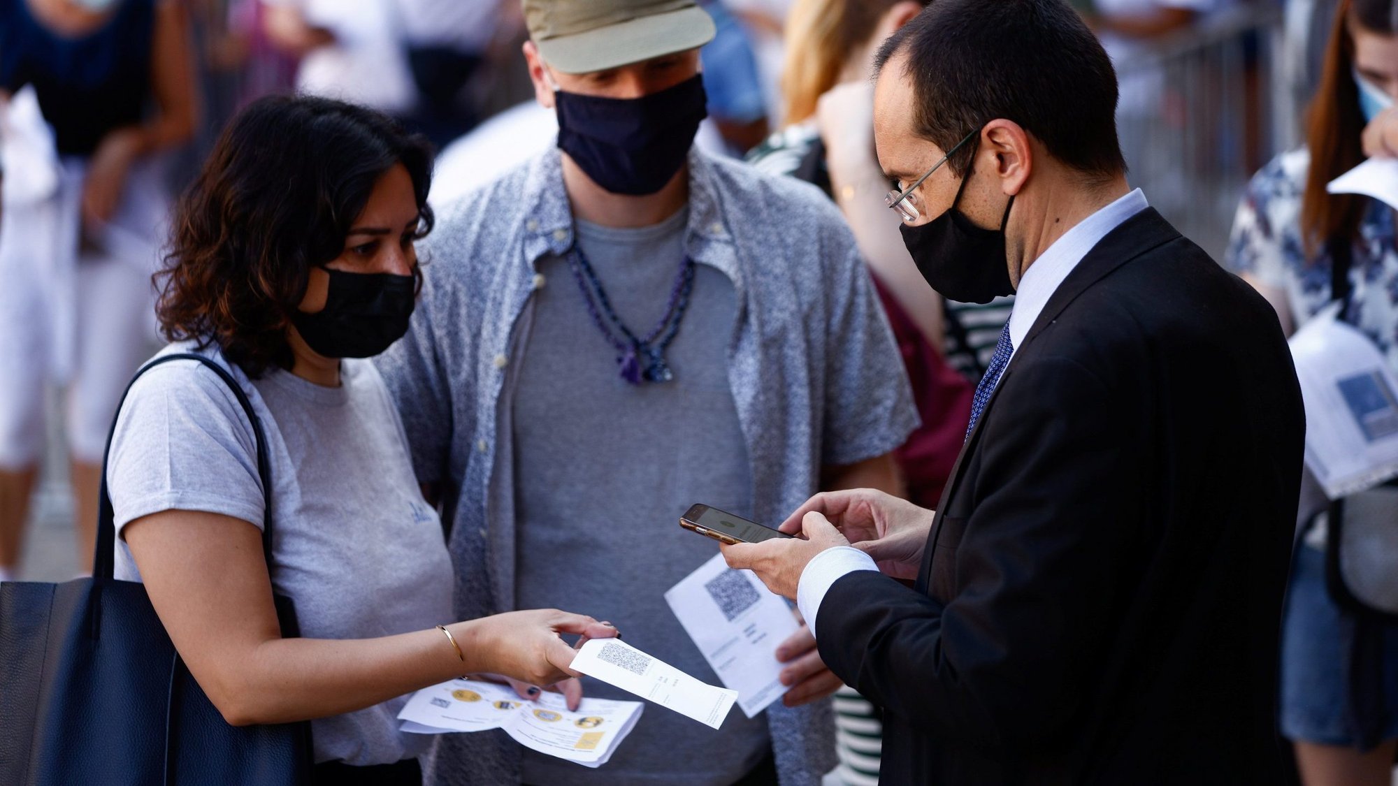 People have their Green Pass, signifying vaccination against COVID-19 or a negative test taken within 48 hours, checked before entering the Vatican Museums at the Vatican in this Aug. 6, 2021, file photo. Beginning Oct. 1 the Vatican will require proof of vaccination or a negative COVID test from most people wanting to enter Vatican territory or offices. People attending Vatican liturgies are exempt from the requirements. (CNS photo/Guglielmo Mangiapane, Reuters)