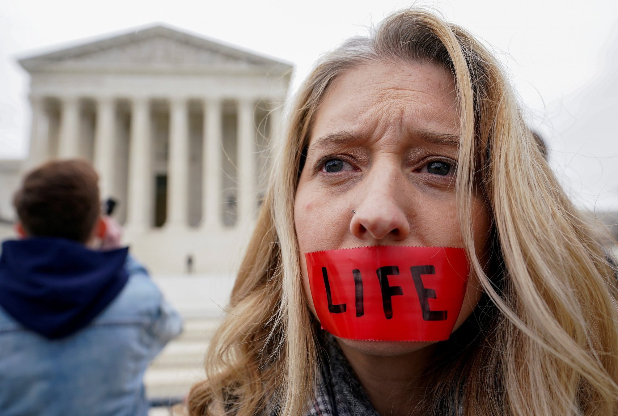 A pro-life activist is seen outside the U.S. Supreme Court building in Washington Jan. 24, 2020. (CNS photo/Kevin Lamarque, Reuters)