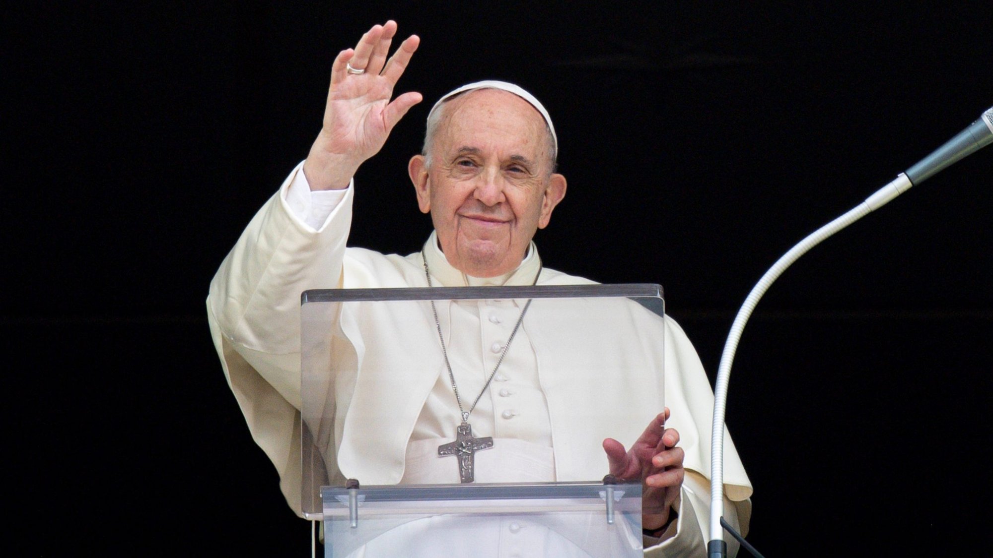 Pope Francis greets the crowd as he leads the Angelus from the window of his studio overlooking St. Peter's Square at the Vatican Sept. 26, 2021. (CNS photo/Vatican Media)