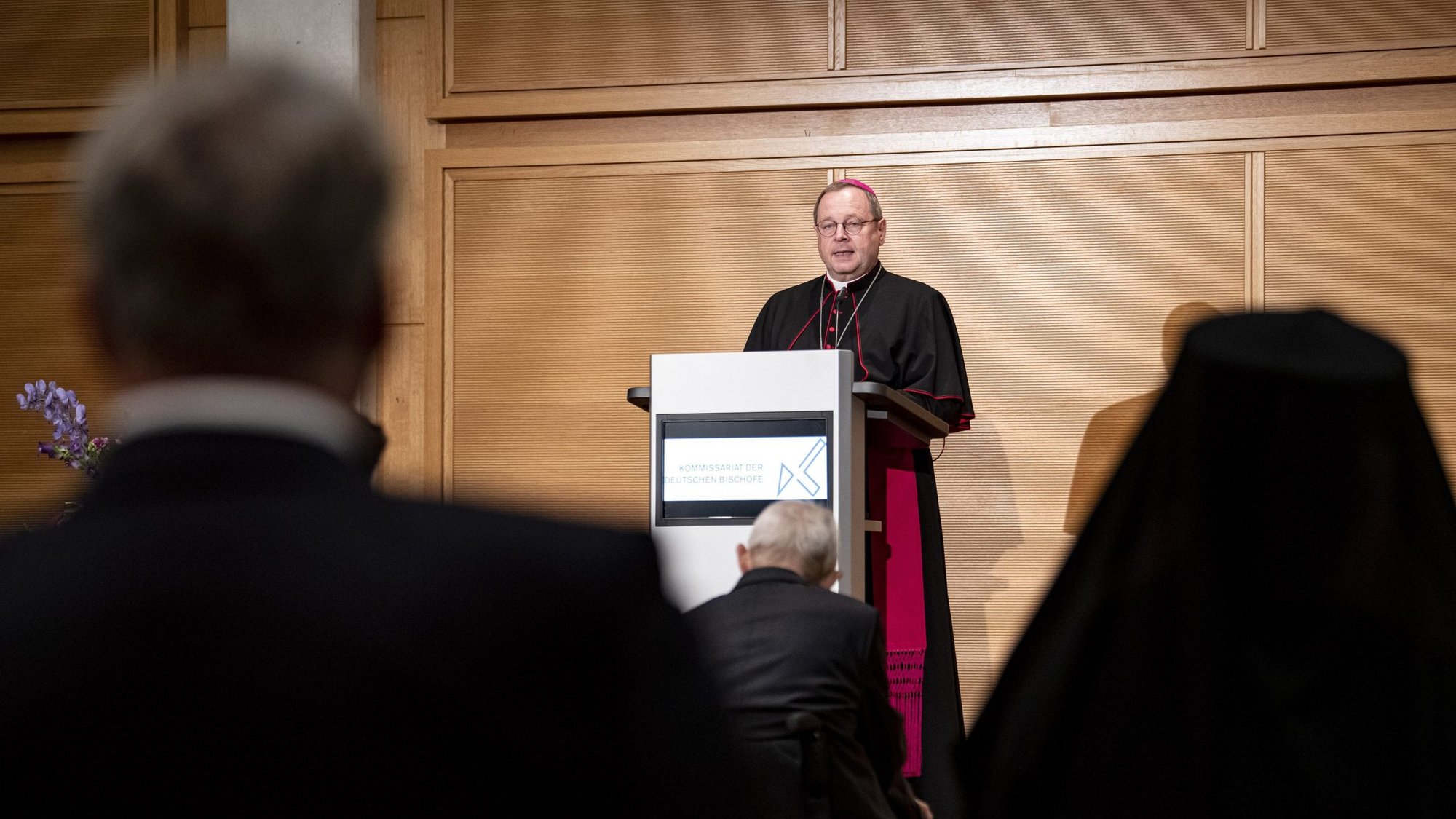 Bishop Georg Bätzing, president of the German bishops' conference, speaks at the annual St. Michael's reception in Berlin Sept. 27, 2021. Bishop Bätzing criticized the Vatican's stance of refusing blessings for same-sex couples and the way it has dealt with German bishops embroiled in covering up sexual abuse in their dioceses. His speech was delivered in the presence of some 200 faith representatives and politicians, including German Chancellor Angela Merkel. (CNS photo/Fabian Sommer, KNA pool)