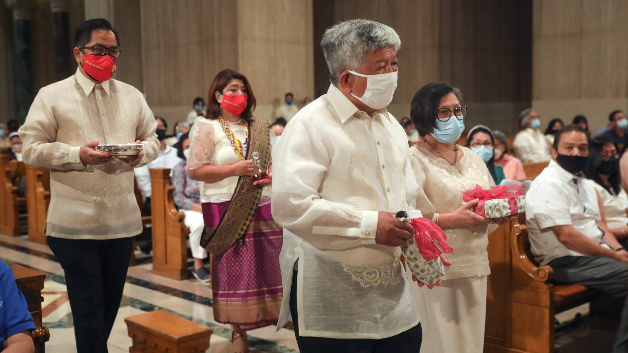Jaime Ramon Ascalon Jr., deputy chief of mission at the Philippines Embassy in Washington, is seen Sept. 18, 2021, at the offertory during a Mass at the Basilica of the National Shrine of the Immaculate Conception in Washington. The Mass celebrated the 500th anniversary of Christianity in the Philippines. (CNS photo/Andrew Biraj, Catholic Standard)