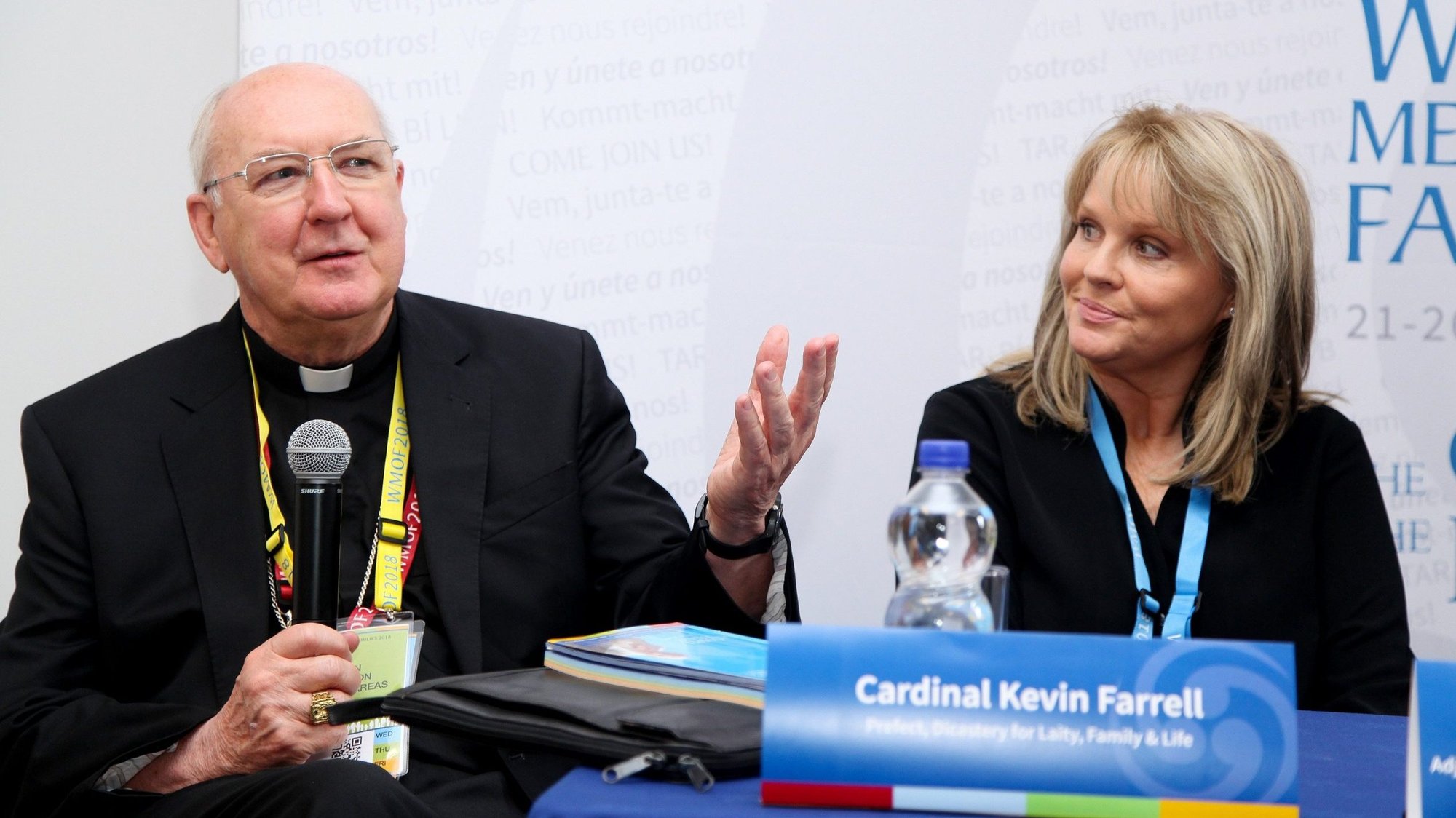 Mary Aiken, a cyberpsychologist, looks on as Cardinal Kevin Farrell, head of the Vatican's Dicastery for Laity, the Family and Life, speaks during an Aug. 22, 2018, news conference during the World Meeting of Families in Dublin. At a Sept. 30, 2021, media briefing, Cardinal Farrell presented details of the World Meeting of Families, which will take place in Rome in 2022. (CNS photo/courtesy John McElroy, World Meeting of Families)