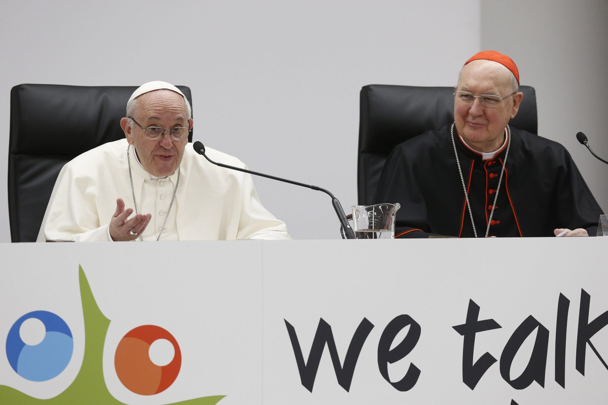Pope Francis speaks at a pre-synod gathering of youth delegates in Rome in this 2018 file photo. Also pictured is U.S. Cardinal Kevin J. Farrell, prefect of the Vatican's Dicastery for Laity, Family and Life. (CNS/Paul Haring)