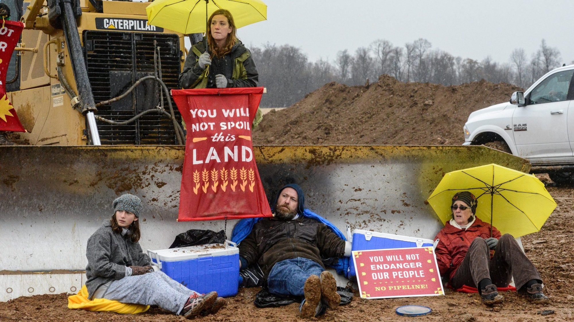 Activists with Lancaster Against Pipelines block construction of a pipeline Nov. 18, 2017, in Holtwood, Pa. The Adorers of the Blood of Christ, a religious order that has been challenging construction of a natural gas transmission line through its Pennsylvania property for years, expressed disappointment Oct. 1, 2021, that a federal court judge dismissed their lawsuit based on a religious freedom claim. (CNS photo/Stephanie Keith, Reuters)