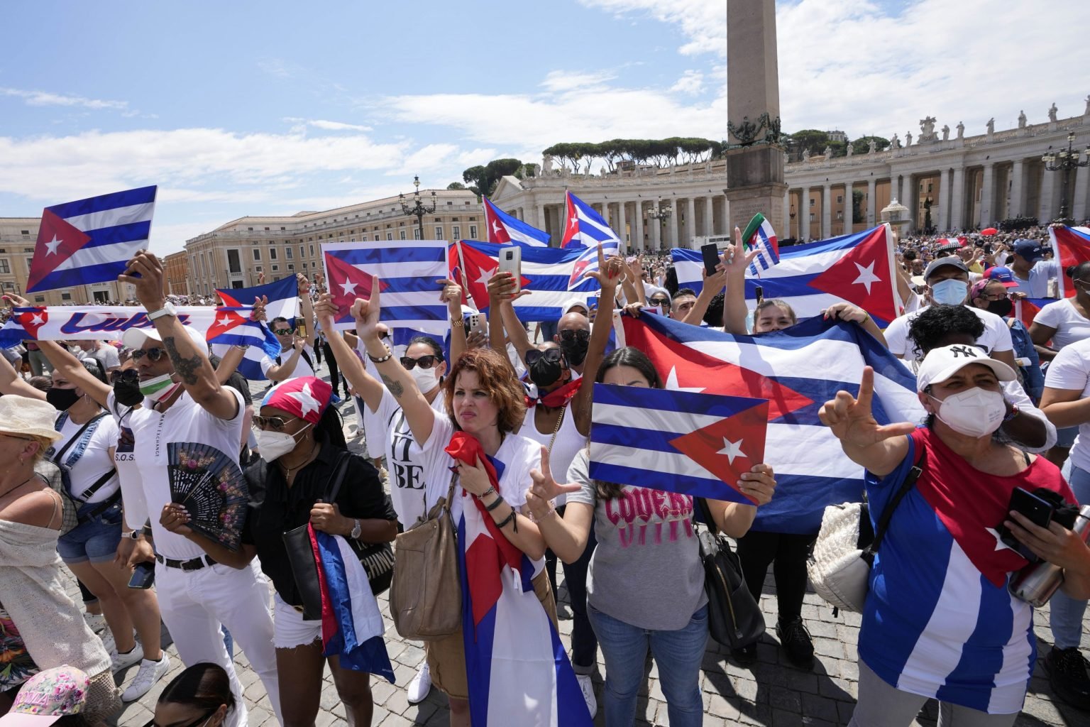 Members of Italian Cuban community show flags during Pope Francis's Angelus noon prayer from the window of his studio overlooking St.Peter's Square, at the Vatican, Sunday, July 18, 2021. (Alessandra Tarantino/AP via Crux)