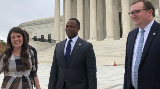Matthew Kuhn, Principal Deputy Solicitor General of Kentucky (right), along with Daniel Cameron, Attorney General of Kentucky (center) and his wife Makenze (left), outside the U.S. Supreme Court on Oct. 12, 2021. (Matt Hadro/CNA)