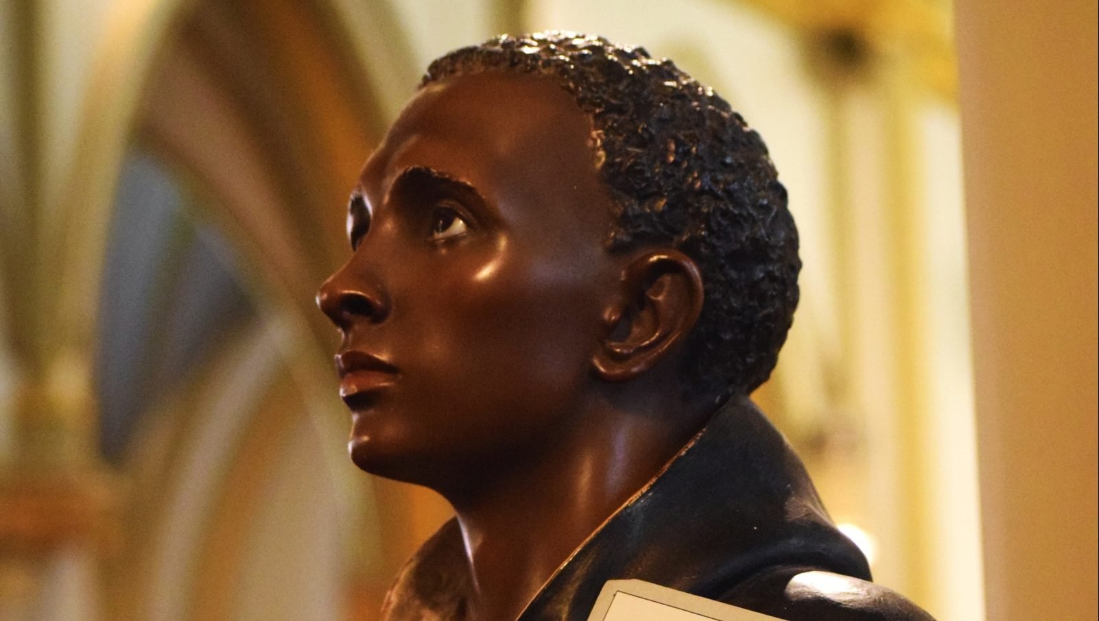 This statue of St. Martin de Porres appears to stand watch at the entrance of St. Augustine Church in Washington July 25, 2019. (CNS photo/Elizabeth Bachmann)
