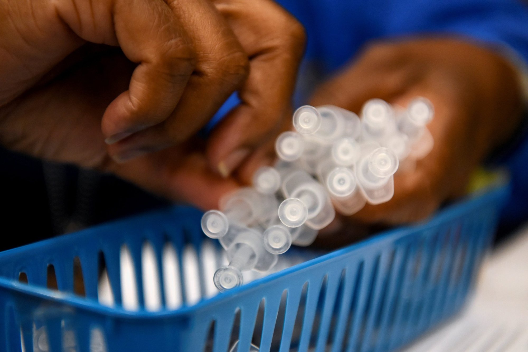 A health care worker at Acres Home Multi-Service Center in Houston prepares doses of the coronavirus disease vaccine Oct. 13, 2021. (CNS photo/Callaghan O'Hare, Reuters)