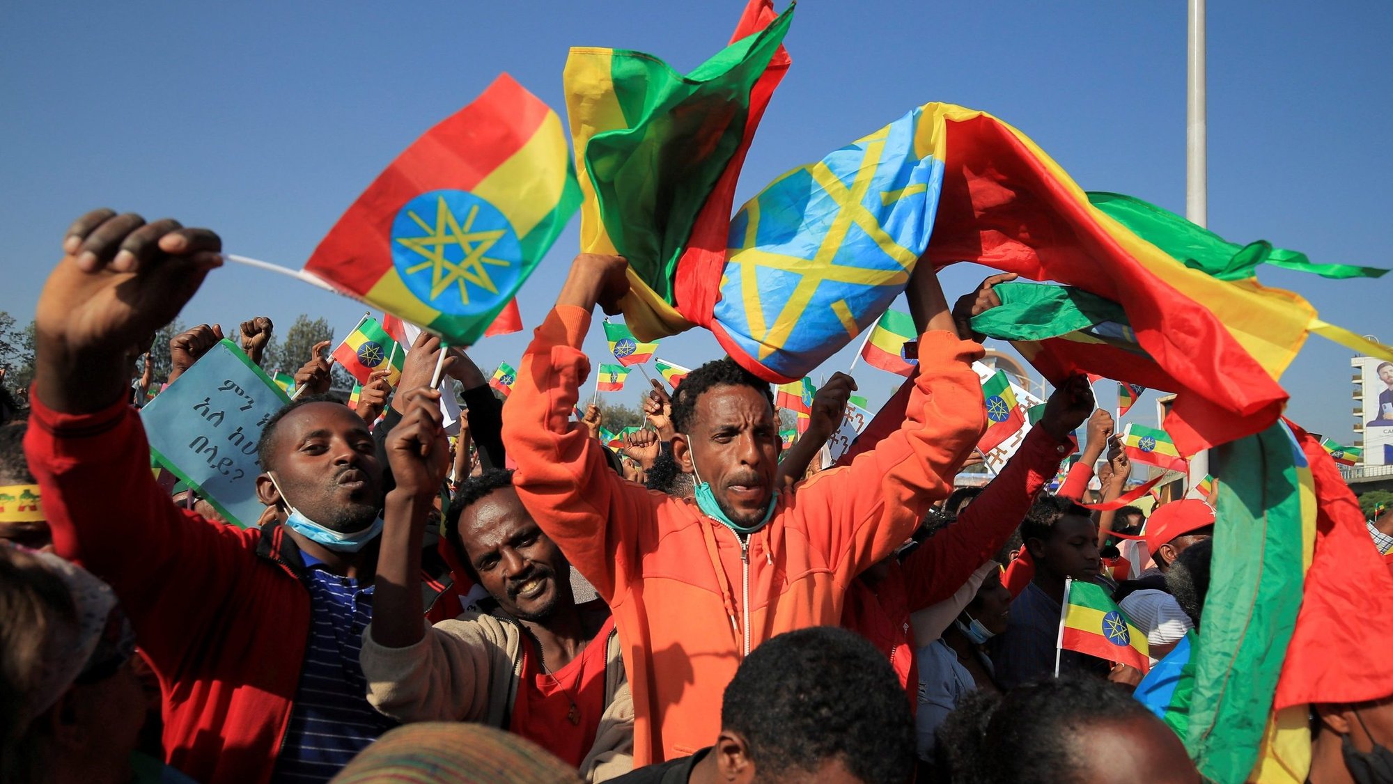 A man holds the Ethiopian national flag during a pro-government rally in Addis Ababa Nov. 7, 2021. People were denouncing what rally organizers say is interference by the Tigray People's Liberation Front and Western countries in internal affairs of the country. (CNS photo/Tiksa Negeri, Reuters)