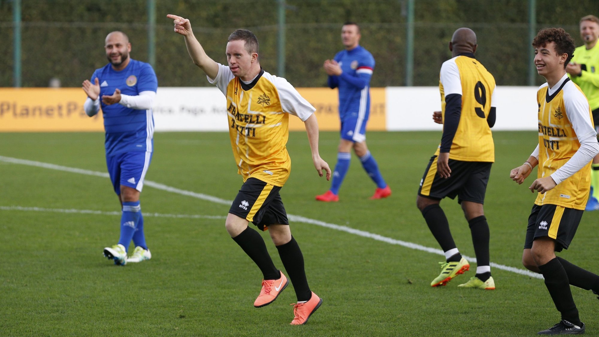 Filippo Montemurri, a player on the Vatican team, "Fratelli Tutti," celebrates after scoring a goal during a friendly soccer match against a team from the World Roma Organization at the Lazio Training Center in Formello near Rome Nov. 21, 2021. The match was played to promote inclusion, including those in Gypsy communities. (CNS photo/Paul Haring)