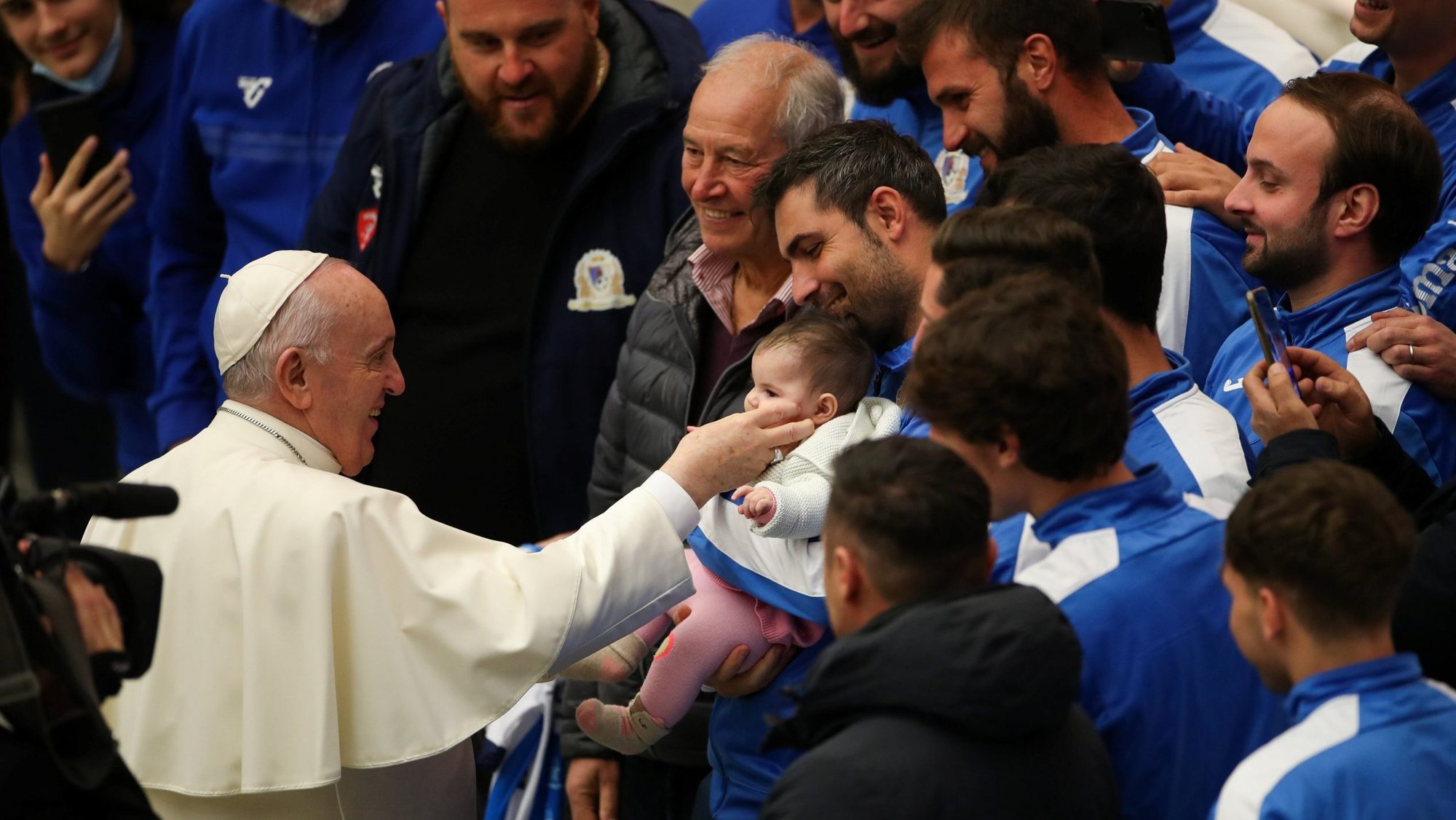 Pope Francis greets a child after his general audience in Paul VI hall at the Vatican Dec. 1, 2021. (CNS photo/Yara Nardi, Reuters)