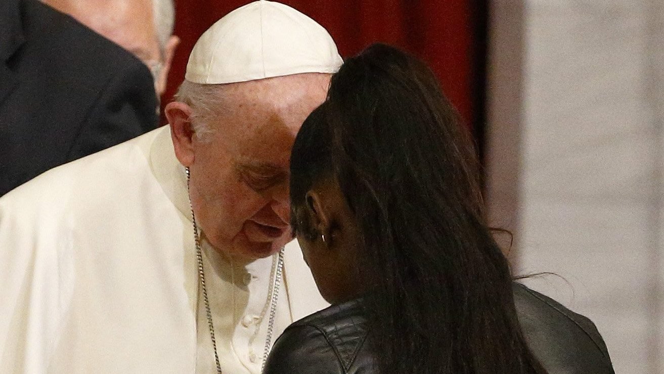 Pope Francis greets Mariamie Besala Welo, an immigrant from Congo, during an ecumenical prayer with migrants in the Church of the Holy Cross in Nicosia, Cyprus, Dec. 3, 2021. (CNS photo/Paul Haring)