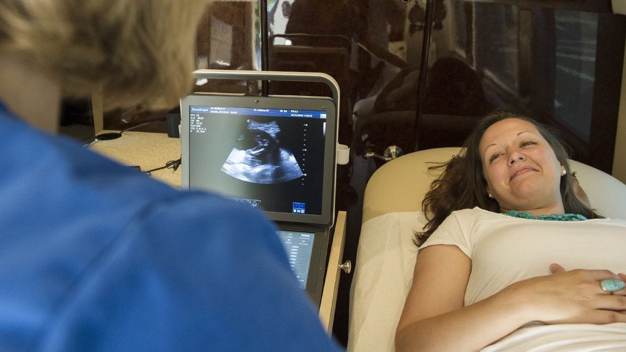 A medical professional speaks with an expectant mother during an ultrasound examination in this 2016 photo. (CNS photo/Thomas Serafin, courtesy Knights of Columbus)