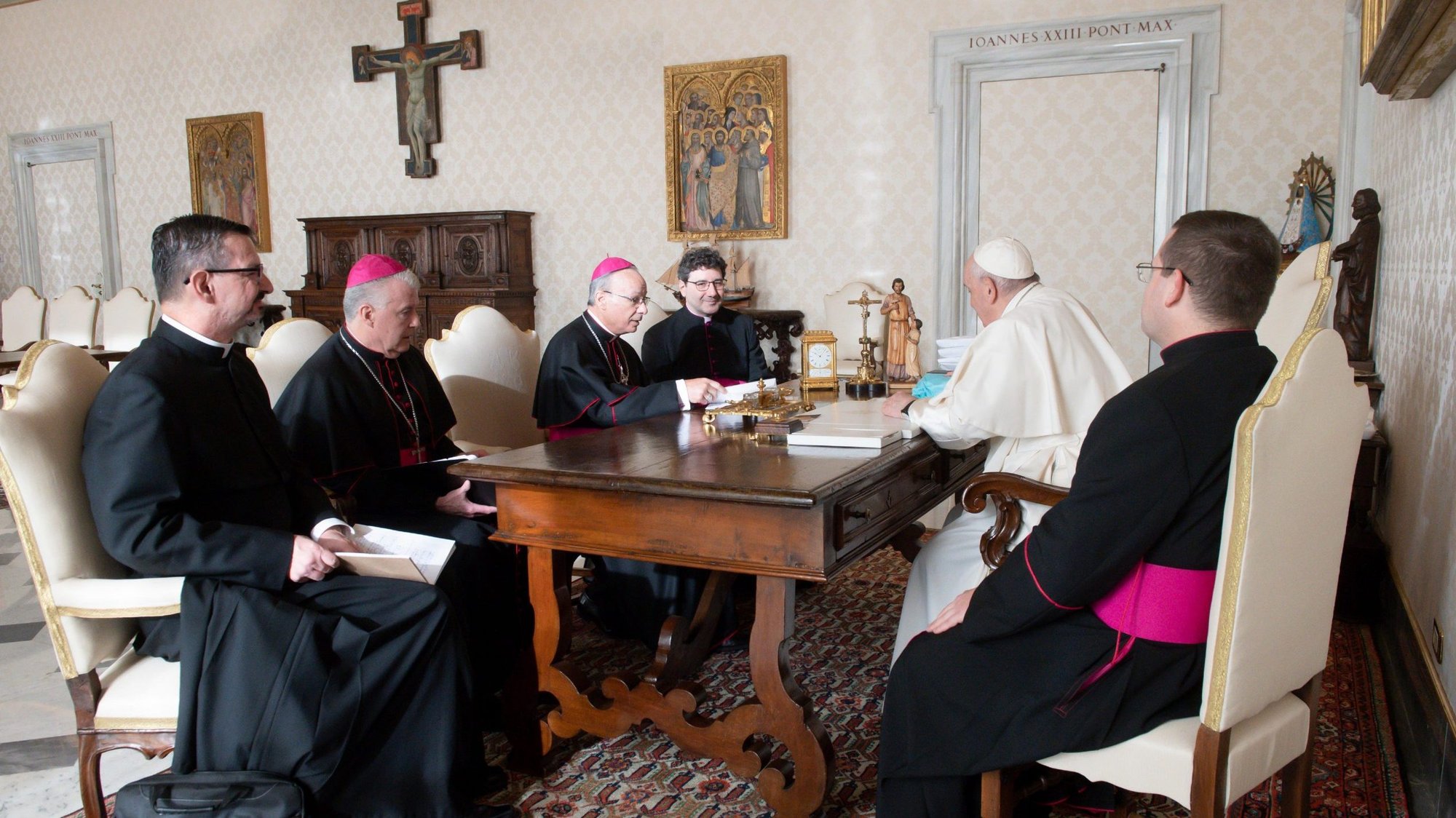 Pope Francis is pictured with officers of the Canadian bishops' conference during a meeting at the Vatican Dec. 9, 2021. The bishops said a delegation of Indigenous people plan to visit the pope next spring and hope the pope can visit Canada after that. Among those pictured are Bishop William Terrence McGrattan of Calgary, Alberta, vice president of the conference, and Bishop Raymond Poisson of Saint-Jérôme and of Mont-Laurier, Quebec, president. (CNS photo/Vatican Media)