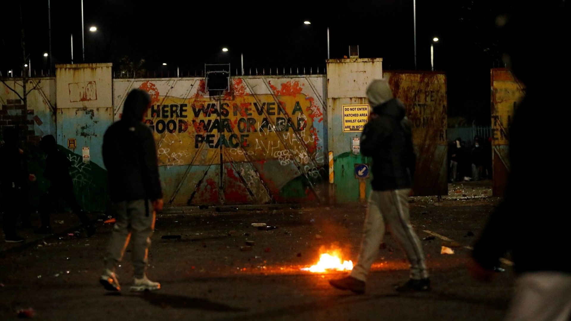 Irish nationalists are seen near the “peace wall” gates into Lanark Way during protests in Belfast, Northern Ireland, April 7, 2021. (Jason Cairnduff/Reuters via CNS)