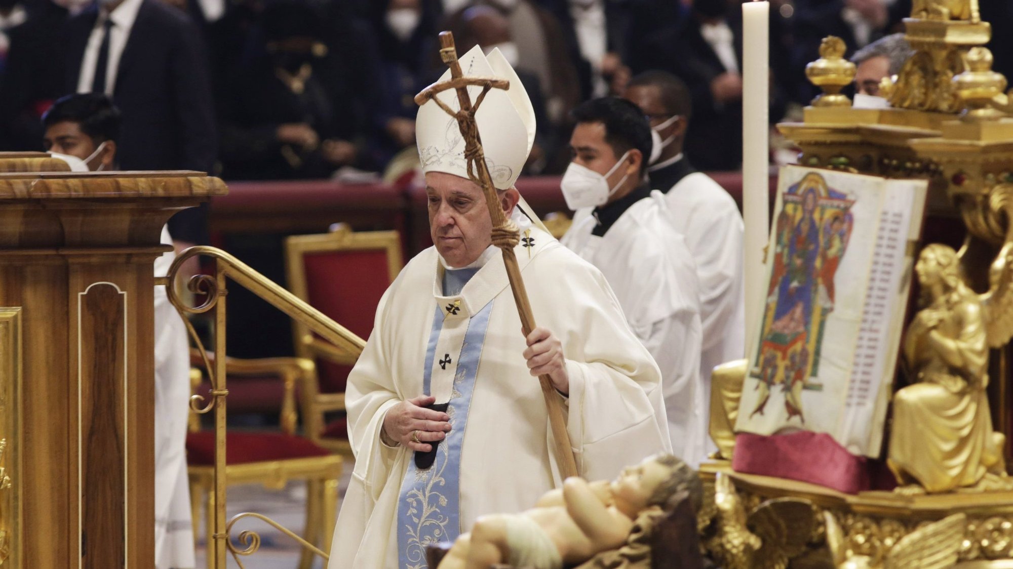 Pope Francis walks near a figurine of the baby Jesus as he leaves in procession after celebrating Mass marking the feast of Mary, Mother of God, in St. Peter's Basilica at the Vatican Jan. 1, 2022. (CNS photo/Romano Siciliani, pool)