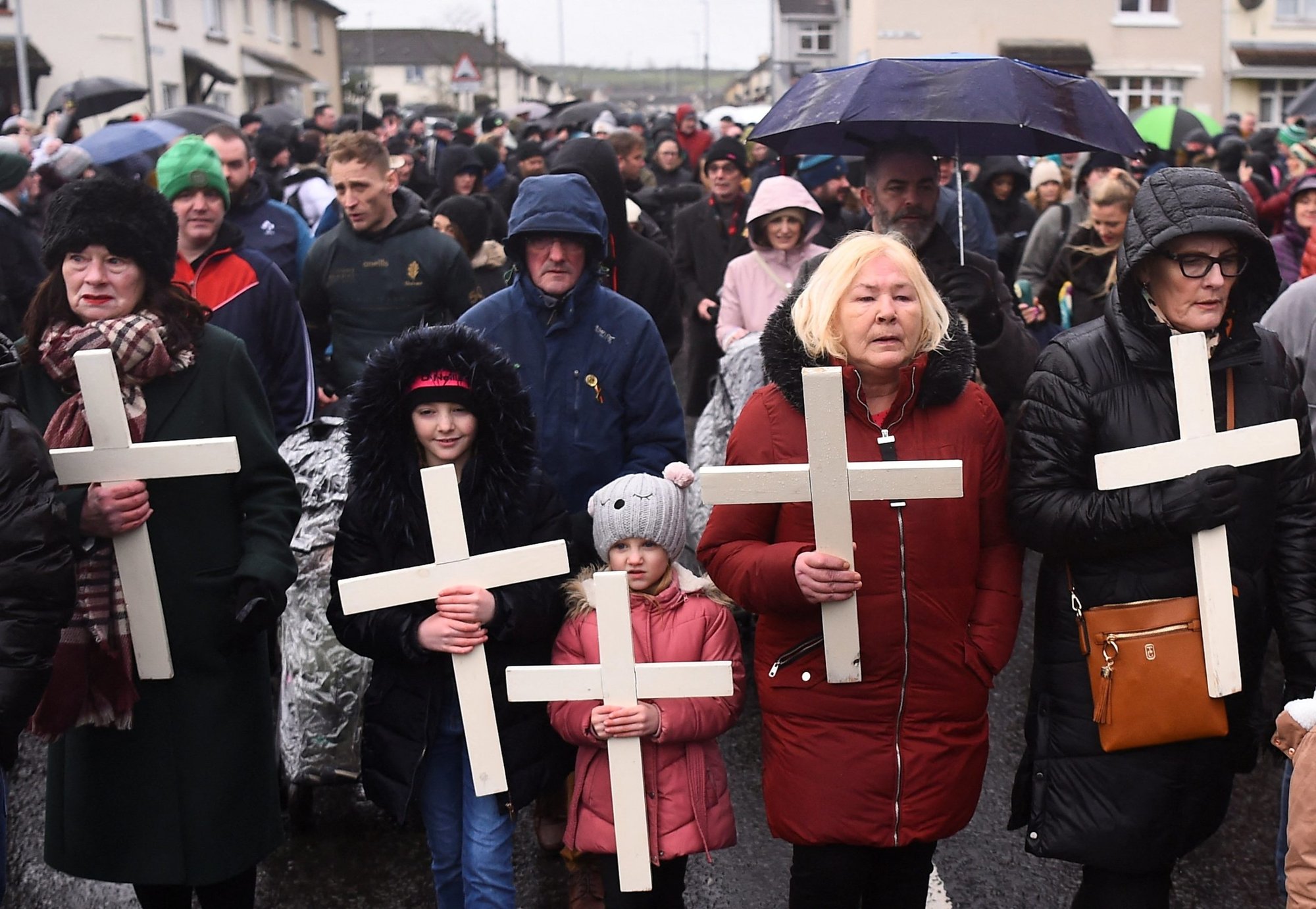 Women and children carry crosses during a memorial service to mark the 50th anniversary of Bloody Sunday in Londonderry, Northern Ireland, Jan. 30, 2022. The head of the Irish bishops' conference has noted that no one has ever been prosecuted for the British army killing of 14 unarmed Catholics in 1972. (CNS photo/Clodagh Kilcoyne, Reuters)