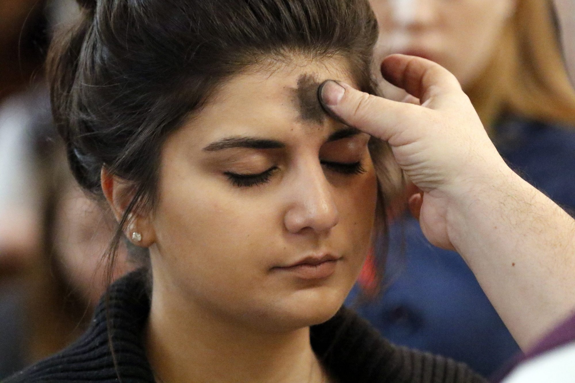 A woman receives ashes during Ash Wednesday Mass at St. Patrick's Pro-Cathedral in Newark, New Jersey, in this 2017 file photo. (CNS photo/Gregory A. Shemitz)