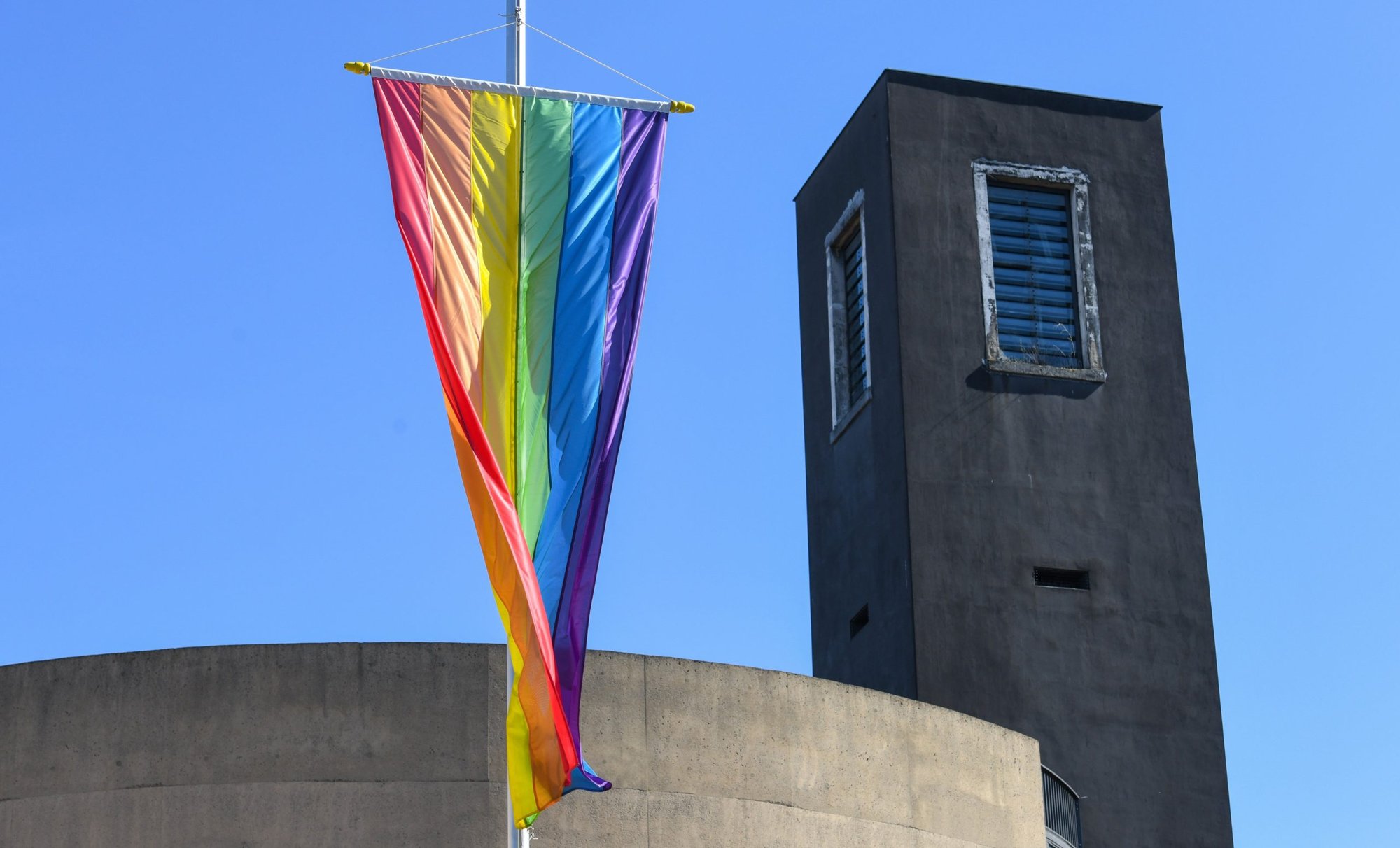A large rainbow flag hangs in front of the Church of St. Theodore in Cologne, Germany, March 29, 2021. Cardinal Jean-Claude Hollerich of Luxembourg, president of the Commission of the Bishops' Conferences of the European Union, said in an interview with news agency KNA that he believes the current church teaching on homosexuality is outdated. (CNS photo/Harald Oppitz, KNA)