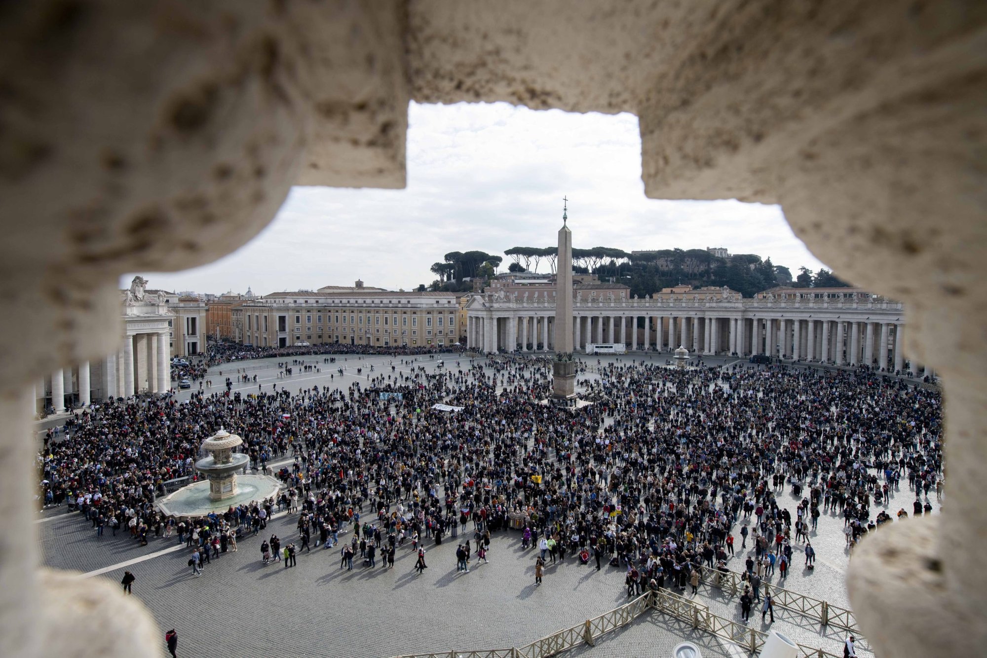 People in St. Peter's Square attend the Angelus led by Pope Francis from the window of his studio overlooking the square at the Vatican Feb. 13, 2022. (CNS photo/Vatican Media)
