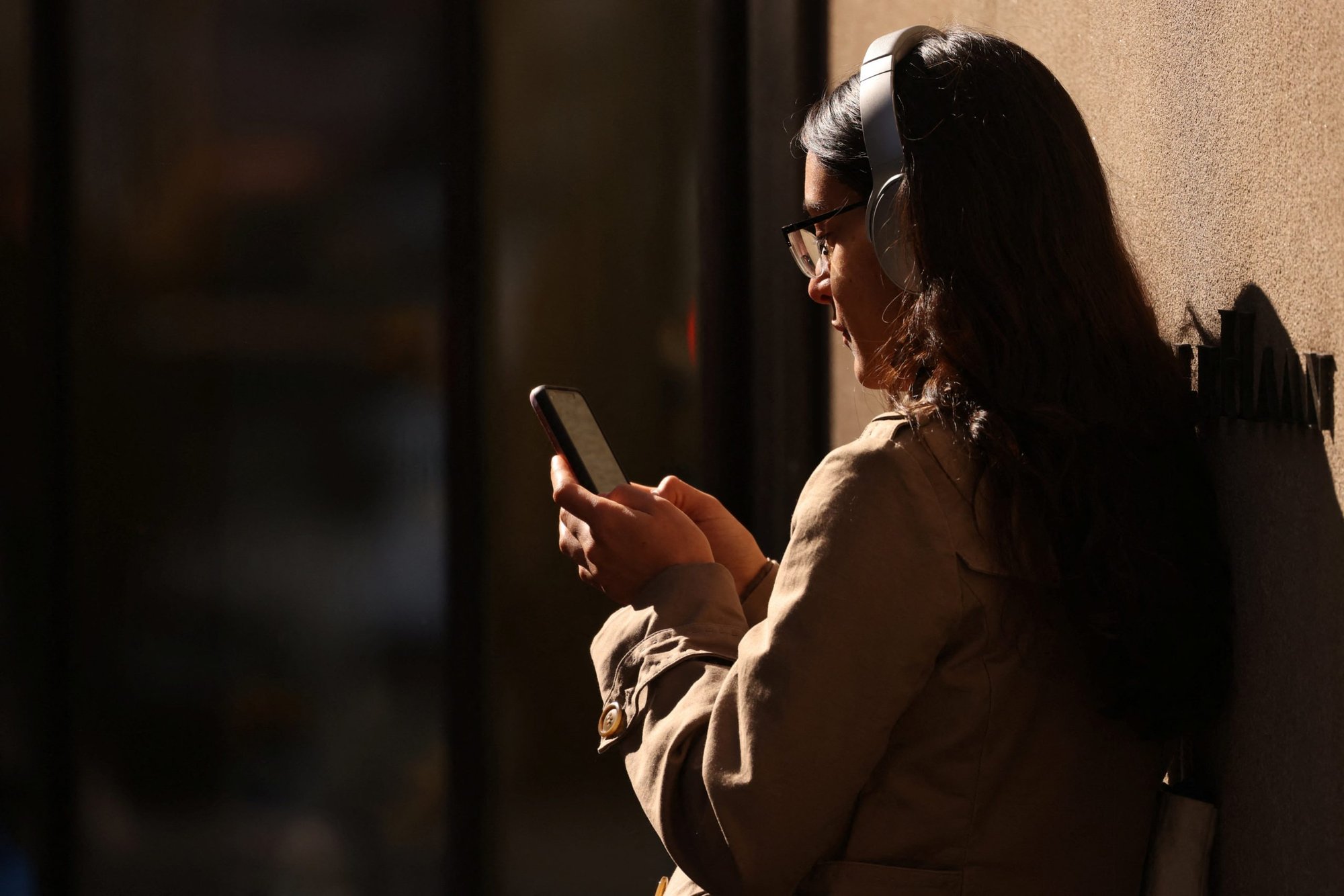 A person uses a smartphone in New York City Feb. 11, 2022. (CNS photo/Andrew Kelly, Reuters)