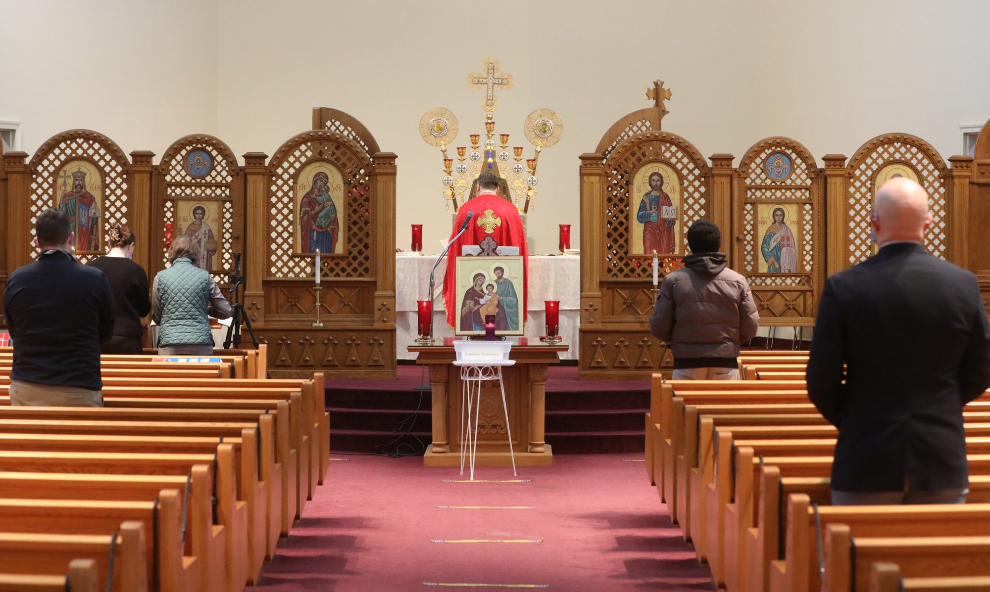 People pray during a morning Divine Liturgy at the Ukrainian Catholic National Shrine of the Holy Family in Washington Feb. 24, 2022, after Russia invaded Ukraine. (CNS photo/Bob Roller)