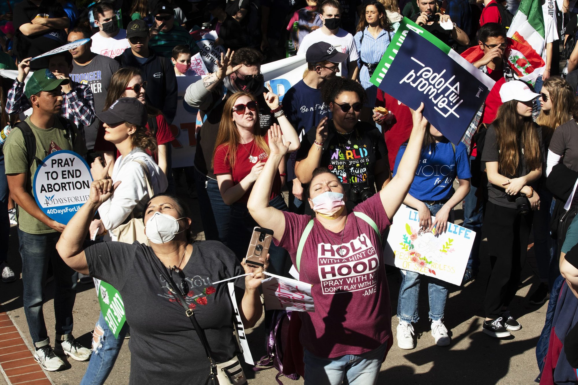 Participants march through the streets of downtown LA during the 2022 OneLife LA. (Victor Alemán)