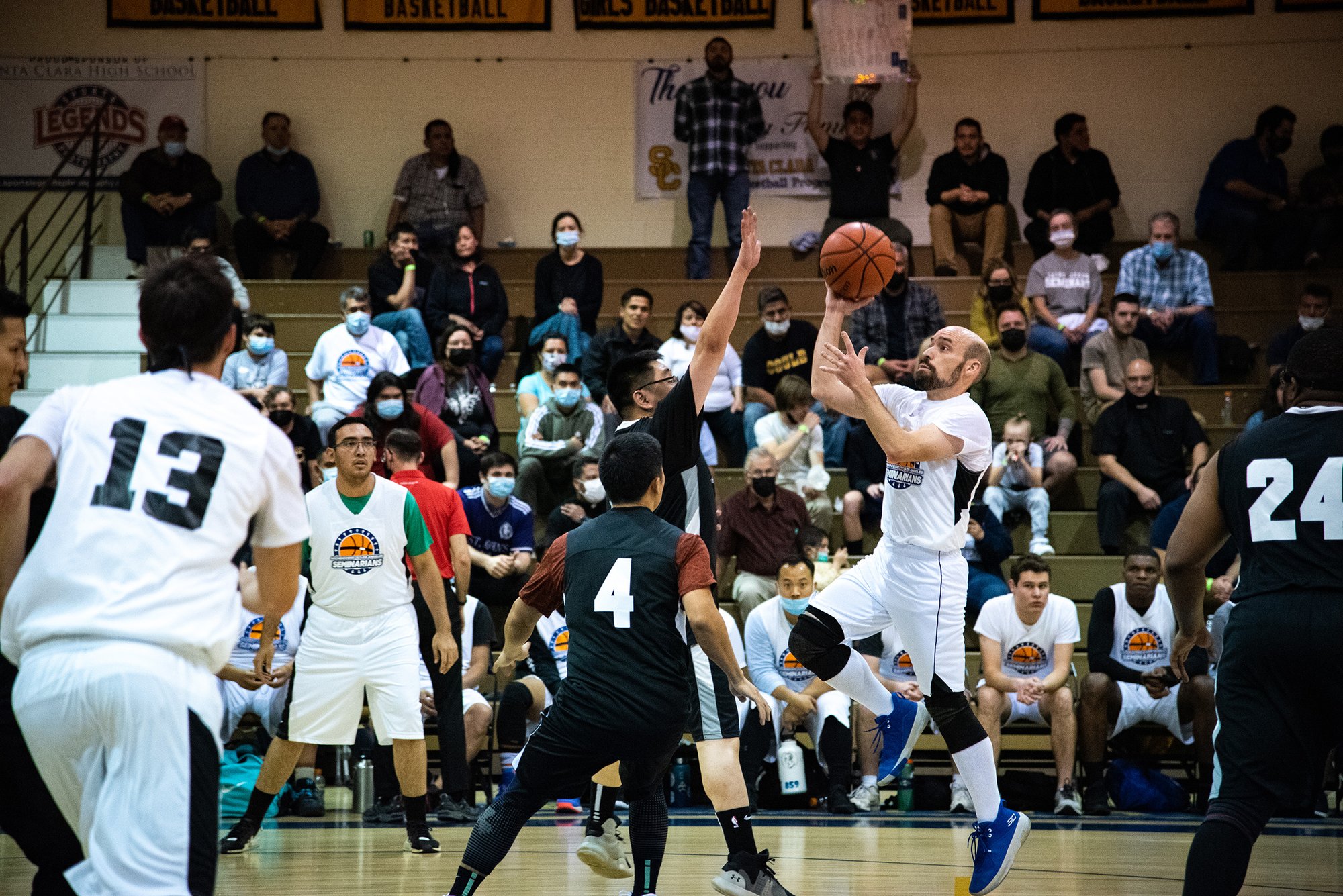 Seminarian Carlos "Buckets" Tobon, a pre-theology student from Incarnation in Glendale, takes a jumpshot during the Archdiocese of LA's Priests vs. Seminarians basketball game Feb. 11. (Vincent Escueta)