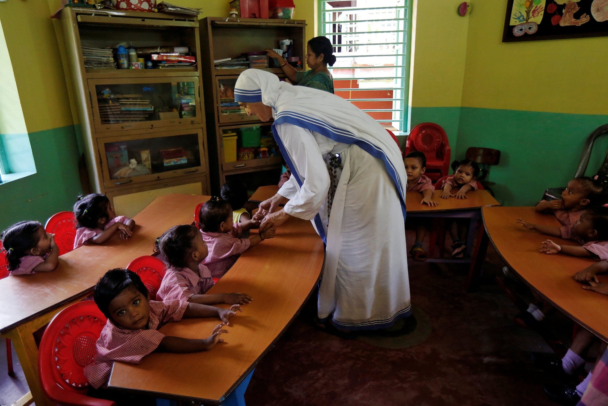 A member of the Missionaries of Charity interacts with the children of a kindergarten inside the Nirmala Shishu Bhavan, a home for orphaned, destitute and abandoned children in Kolkata, India, Aug. 30, 2016. (CNS photo/Rupak De Chowdhuri, Reuters)