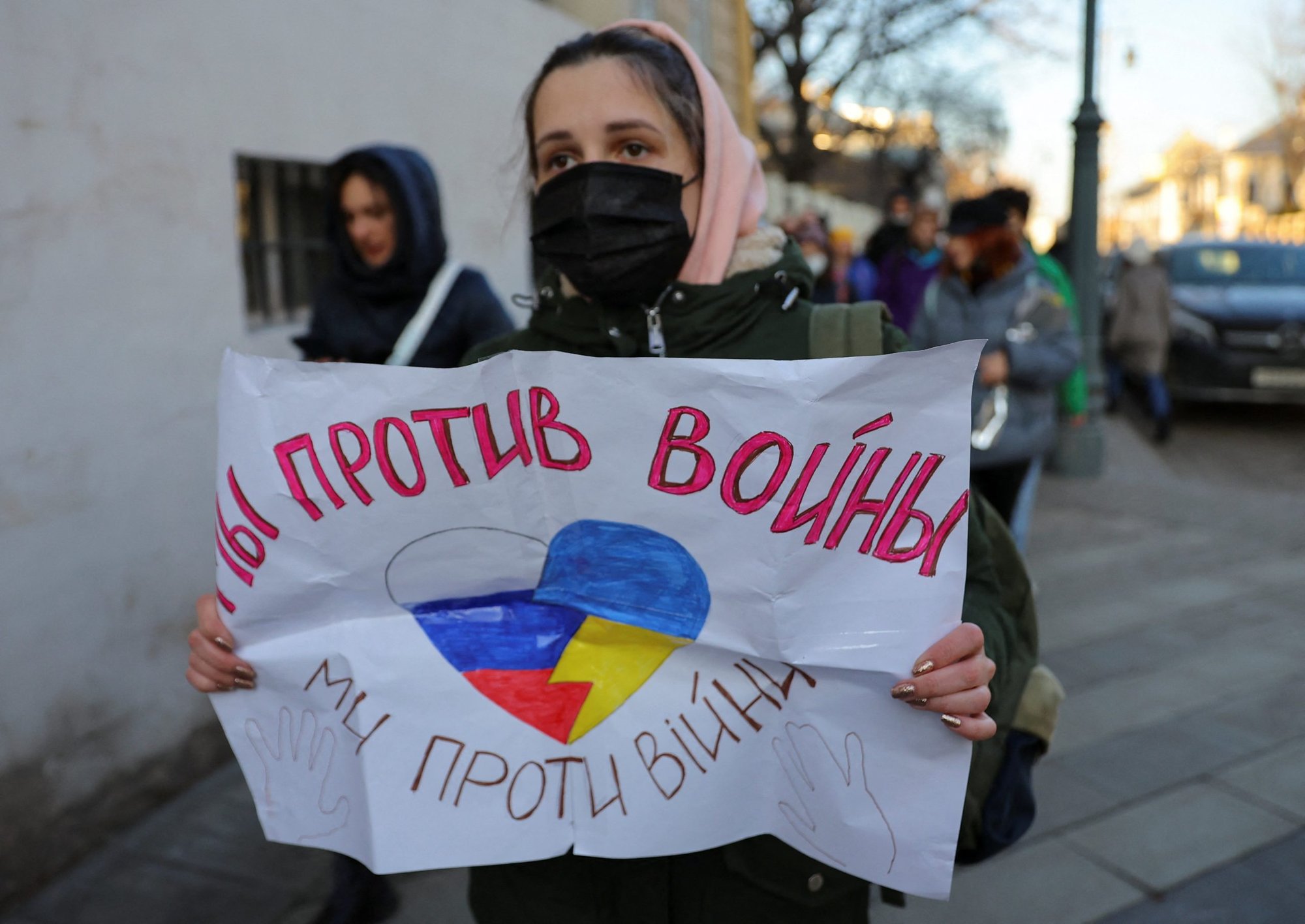 A woman holds a sign that reads "We are against war" during a protest against the Russian invasion of Ukraine, in Moscow Feb. 27, 2022. (CNS photo/Evgenia Novozhenina, Reuters)