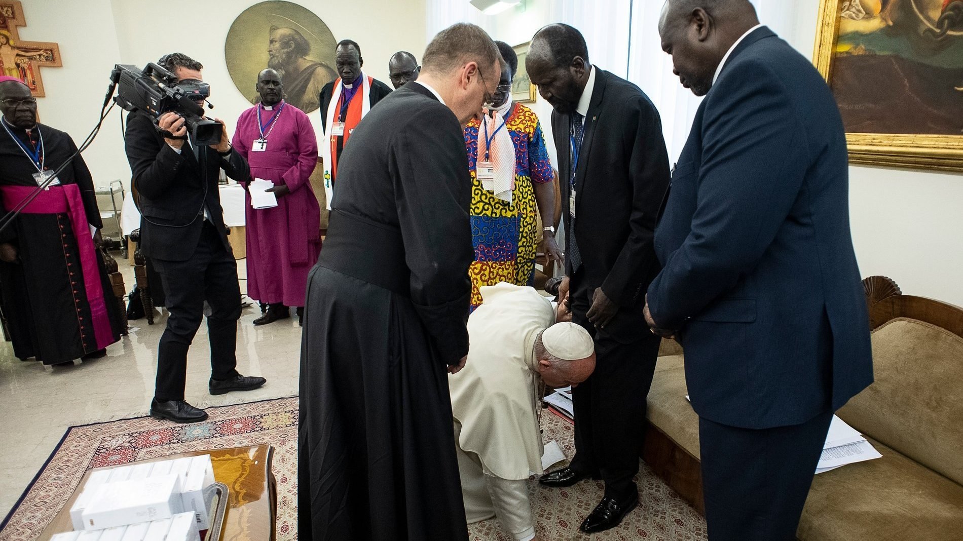 Pope Francis kneels at the feet of South Sudanese President Salva Kiir at the conclusion of a two-day retreat at the Vatican for African nation's political leaders, in this April 11, 2019, file photo. The Vatican announced that Pope Francis will visit Congo and South Sudan in early July. (CNS photo/Vatican Media via Reuters)