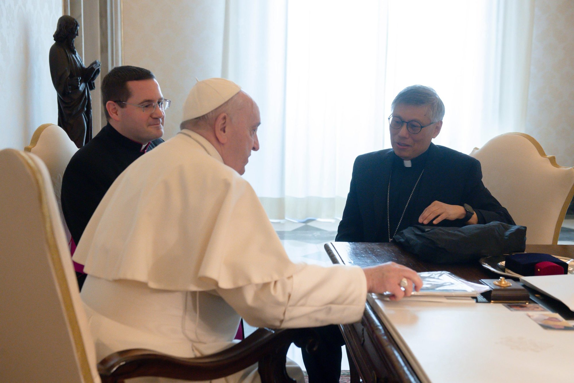 Pope Francis meets with Bishop Stephen Chow Sau-yan of Hong Kong at the Vatican March 17, 2022. During the meeting, Bishop Chow used his phone to record video messages from the pope to the people of Hong Kong and China. (CNS photo/Vatican Media)